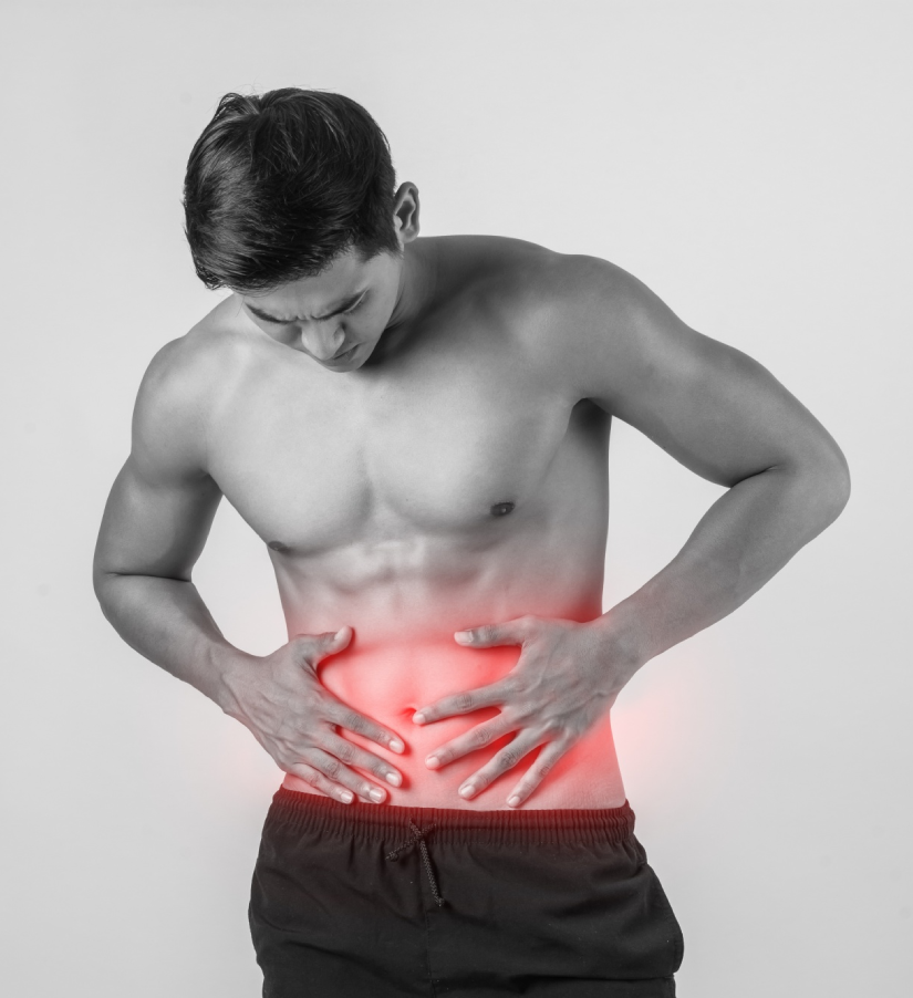 Person indicating the area of a possible groin hernia